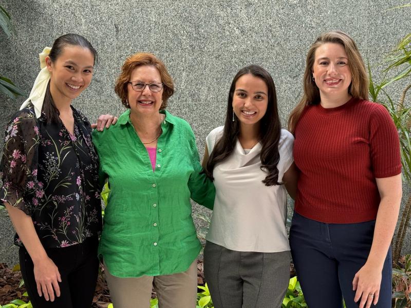 four women smiling