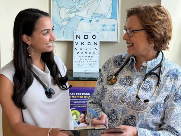 two women doctors talking